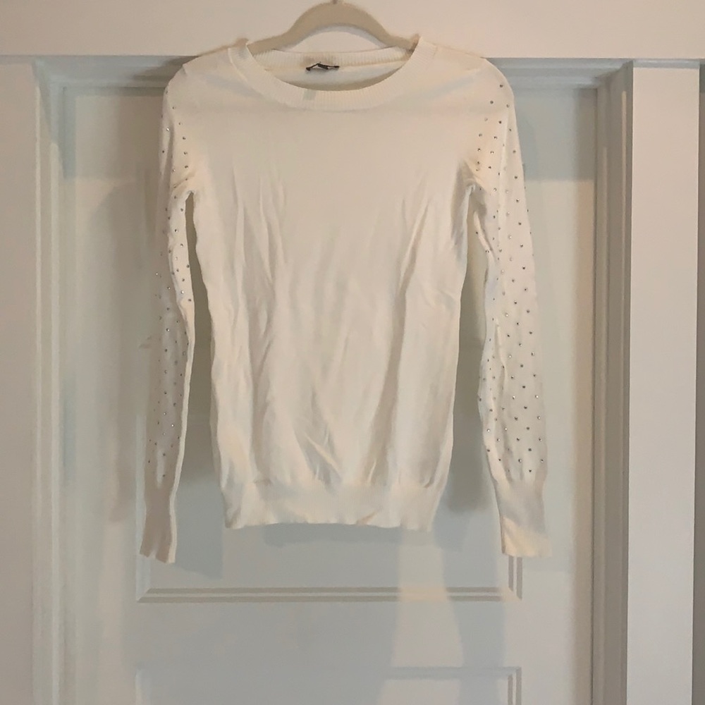 Express light weight sweater. Studs down the sleeves size medium. Cream color